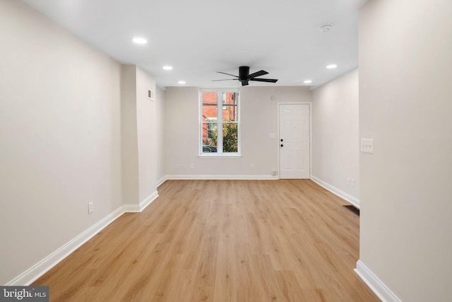 unfurnished room featuring light hardwood / wood-style flooring and ceiling fan