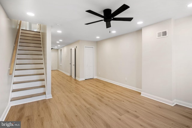 unfurnished living room with ceiling fan and light hardwood / wood-style flooring