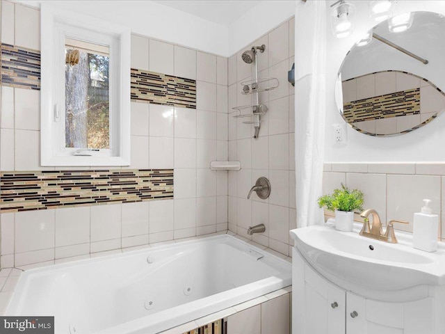 bathroom with shower / bath combo with shower curtain, vanity, and tile walls