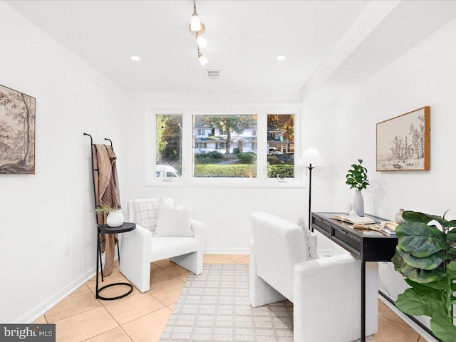 living area featuring light tile patterned floors