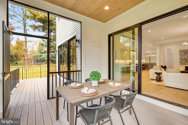 sunroom / solarium with wood ceiling