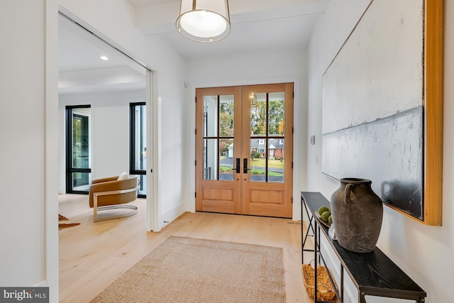 doorway featuring light hardwood / wood-style flooring and french doors