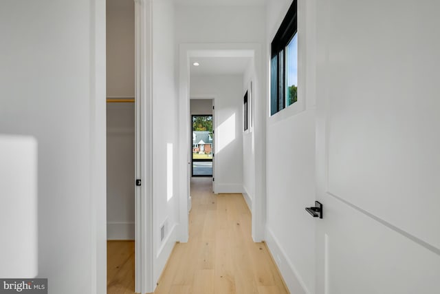 hall with light wood-type flooring