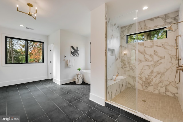 bathroom featuring shower with separate bathtub, tile patterned floors, and a wealth of natural light