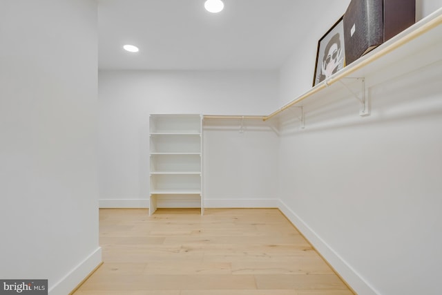 walk in closet featuring wood-type flooring