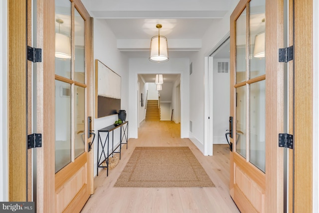 hallway with light wood-type flooring