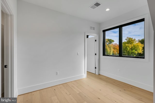 empty room with light wood-type flooring