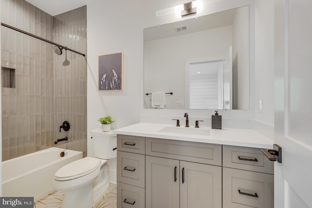 full bathroom with toilet, tiled shower / bath combo, and vanity