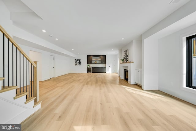 unfurnished living room featuring light hardwood / wood-style flooring