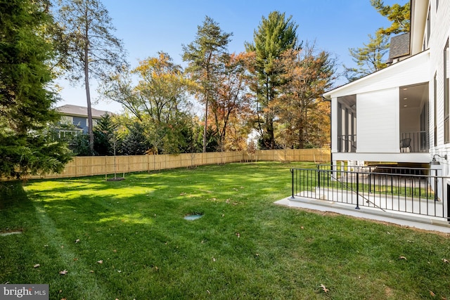 view of yard with a sunroom