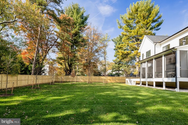 view of yard featuring a sunroom