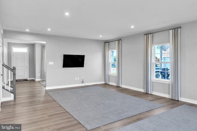 unfurnished living room with light hardwood / wood-style floors