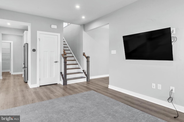 unfurnished living room featuring hardwood / wood-style floors