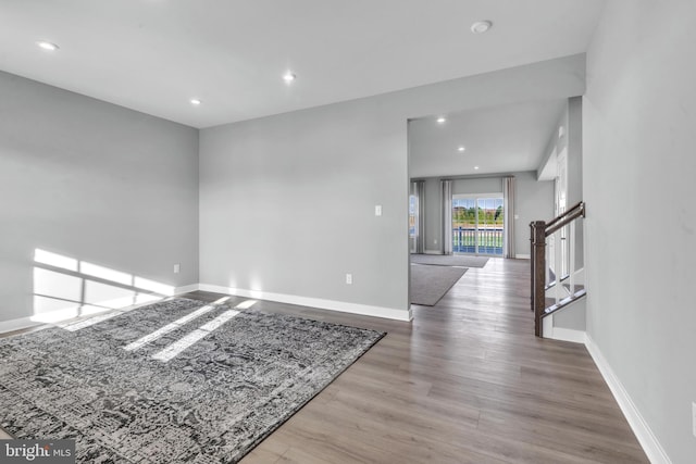 empty room with light hardwood / wood-style flooring