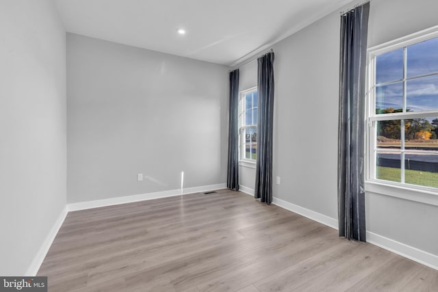 unfurnished room featuring light wood-type flooring