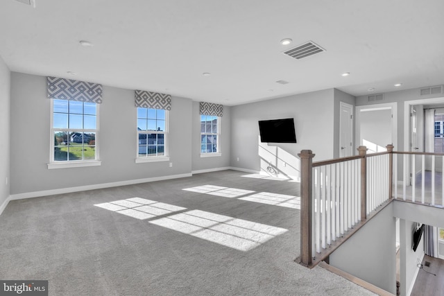 interior space featuring light colored carpet