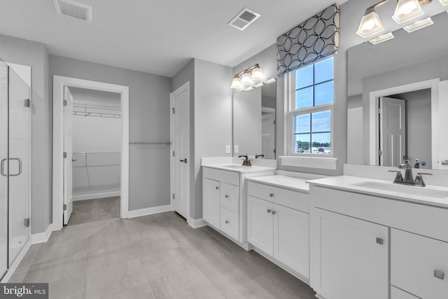 bathroom featuring vanity and walk in shower