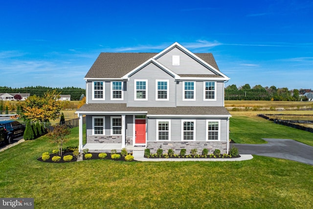 view of front of home with a front lawn