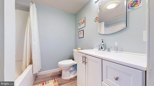 full bathroom with vanity, shower / bath combo with shower curtain, toilet, and wood-type flooring