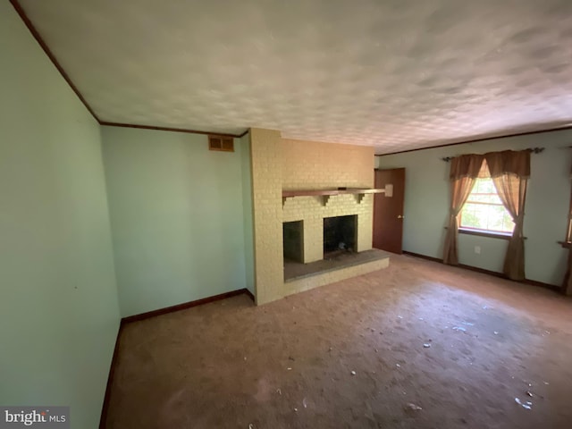 unfurnished living room featuring carpet and a brick fireplace