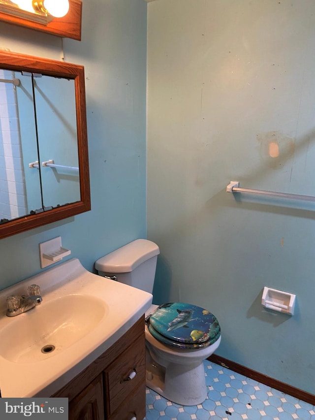 bathroom featuring vanity and toilet