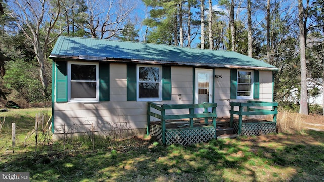 view of front of home featuring a wooden deck