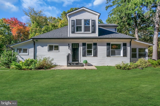 rear view of house with a lawn