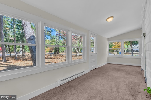 unfurnished sunroom featuring vaulted ceiling, a baseboard heating unit, and a healthy amount of sunlight