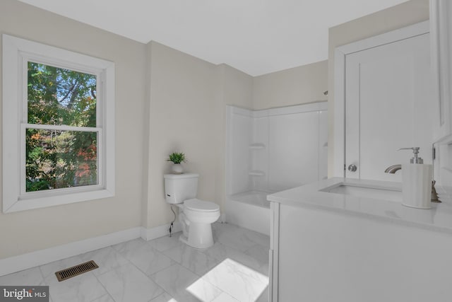 full bathroom with  shower combination, vanity, and toilet