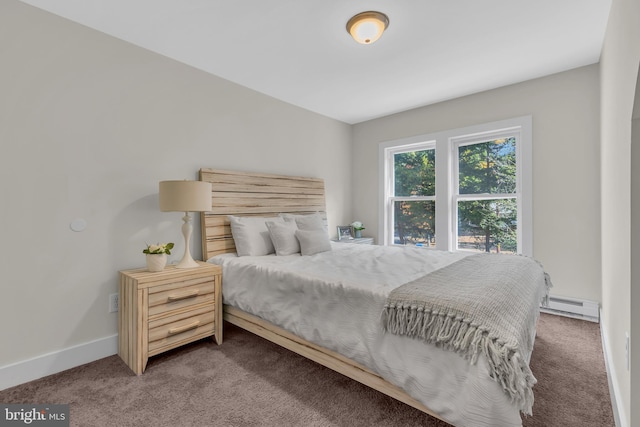 bedroom featuring a baseboard heating unit and carpet floors