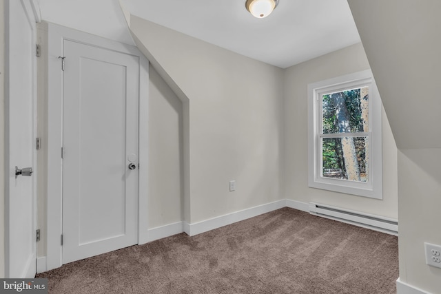 bonus room with carpet flooring and a baseboard radiator