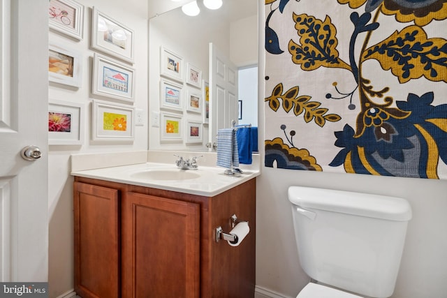 bathroom with toilet and vanity