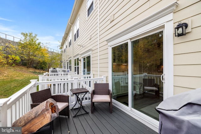 wooden deck featuring grilling area