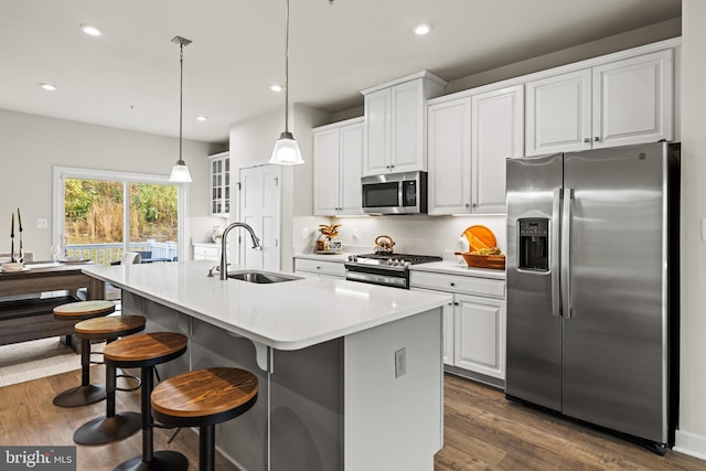 kitchen featuring white cabinetry, stainless steel appliances, and sink