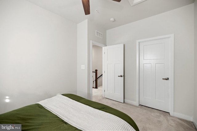 bedroom featuring ceiling fan and light colored carpet