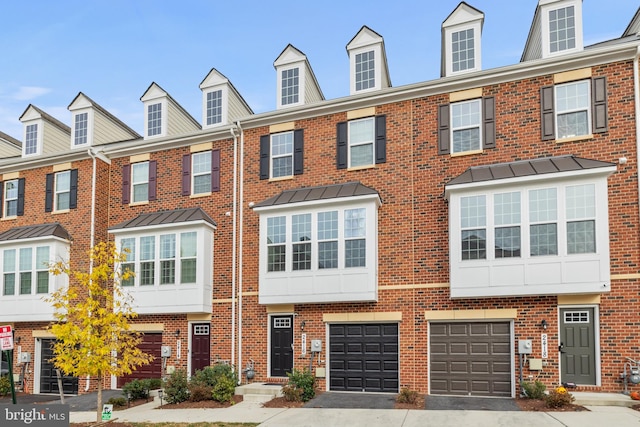 townhome / multi-family property featuring a garage