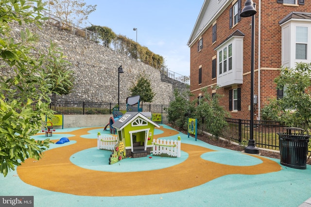 view of home's community featuring a playground