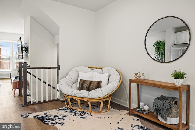 sitting room with wood-type flooring