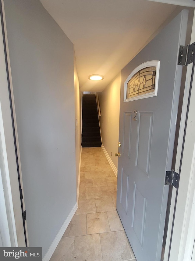 hallway featuring light tile patterned floors