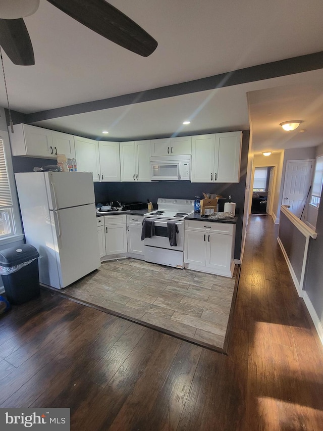 kitchen featuring dark wood-type flooring, white appliances, ceiling fan, and white cabinets