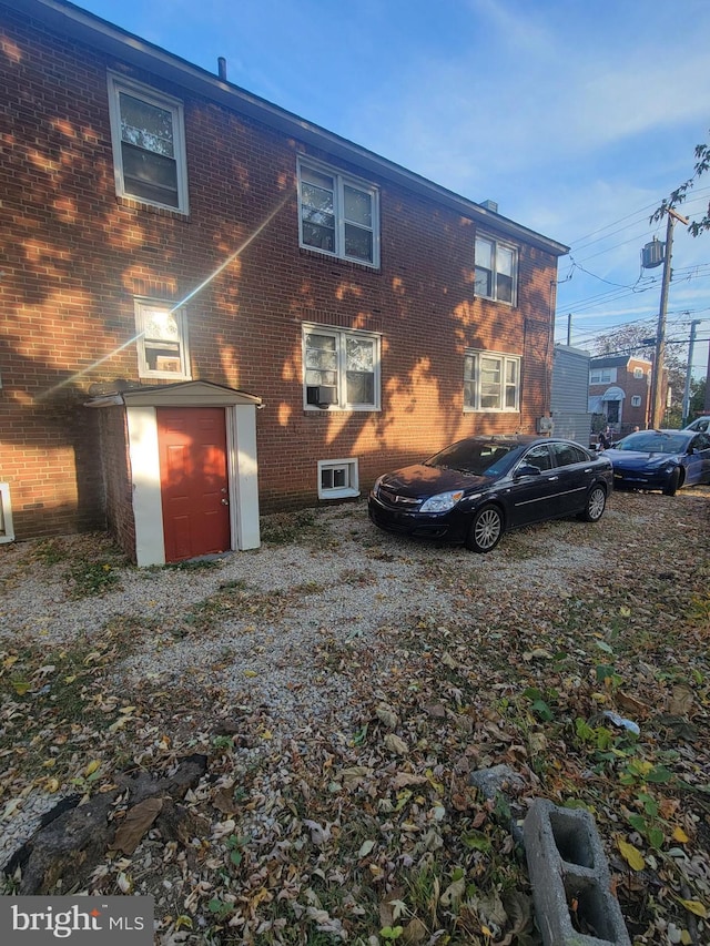 rear view of property featuring cooling unit