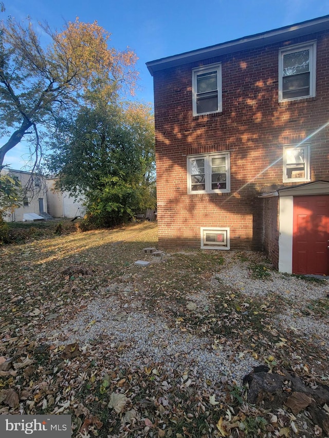 view of side of property featuring a garage