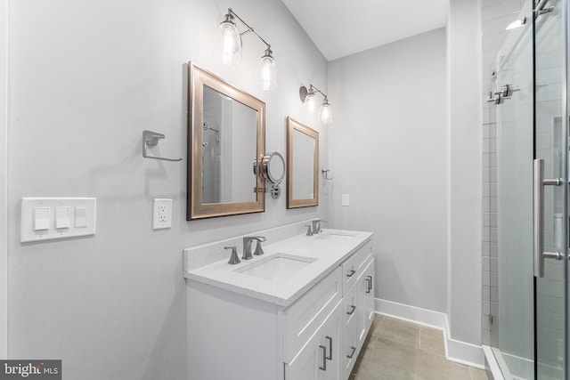 bathroom with vanity, tile patterned flooring, and walk in shower