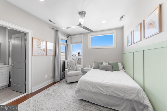 bedroom with hardwood / wood-style floors and ceiling fan