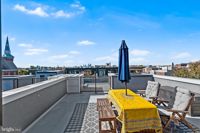 view of patio featuring a balcony