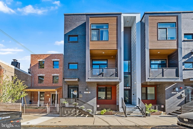 view of front of house with a balcony