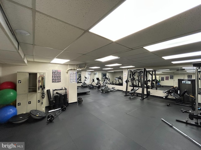 gym featuring a paneled ceiling