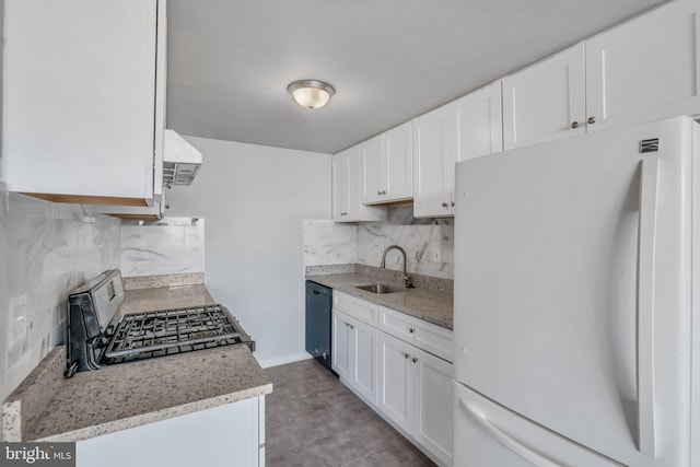 kitchen featuring white refrigerator, black dishwasher, tasteful backsplash, stainless steel range oven, and white cabinetry