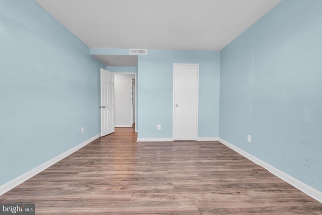 unfurnished bedroom with light wood-type flooring