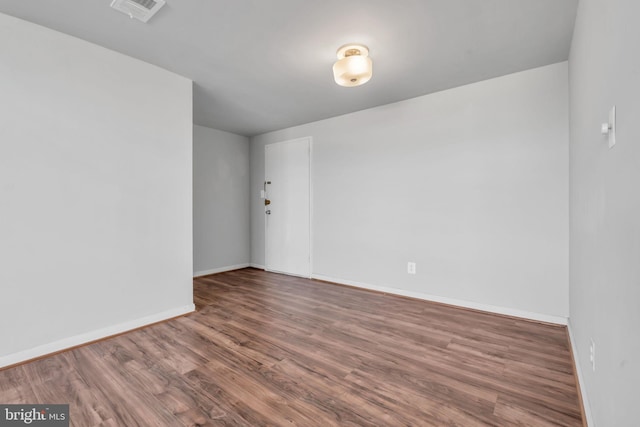 spare room featuring hardwood / wood-style floors